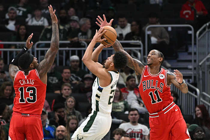 Milwaukee, Wisconsin, USA; Milwaukee Bucks guard Lindell Wigginton (28) shoots the ball as Chicago Bulls forward Torrey Craig (13) and forward DeMar DeRozan (11)